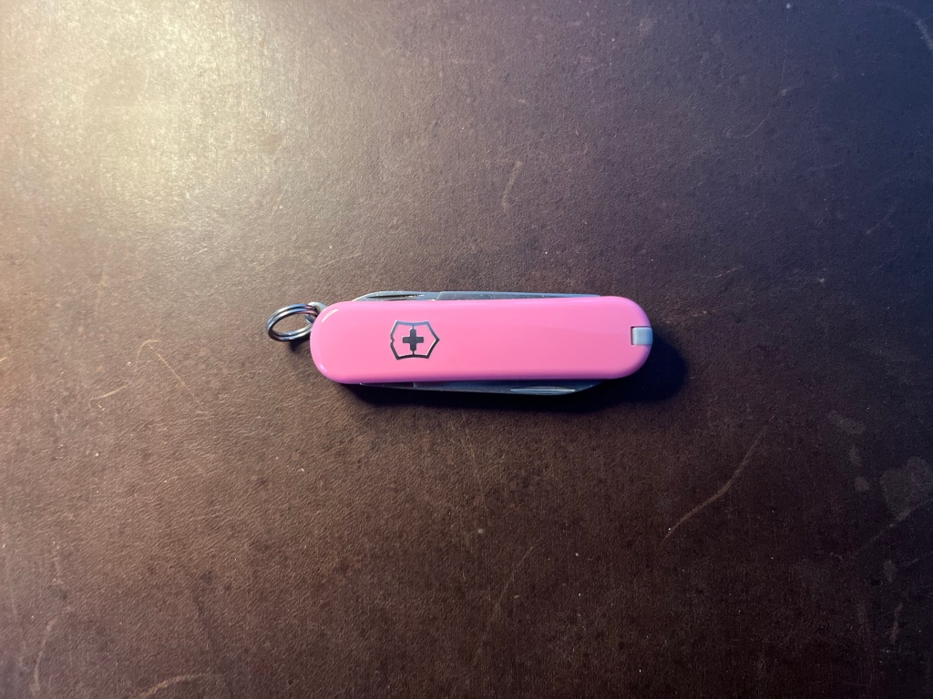 Pink Victorinox Classic SD pocket knife with all tools closed